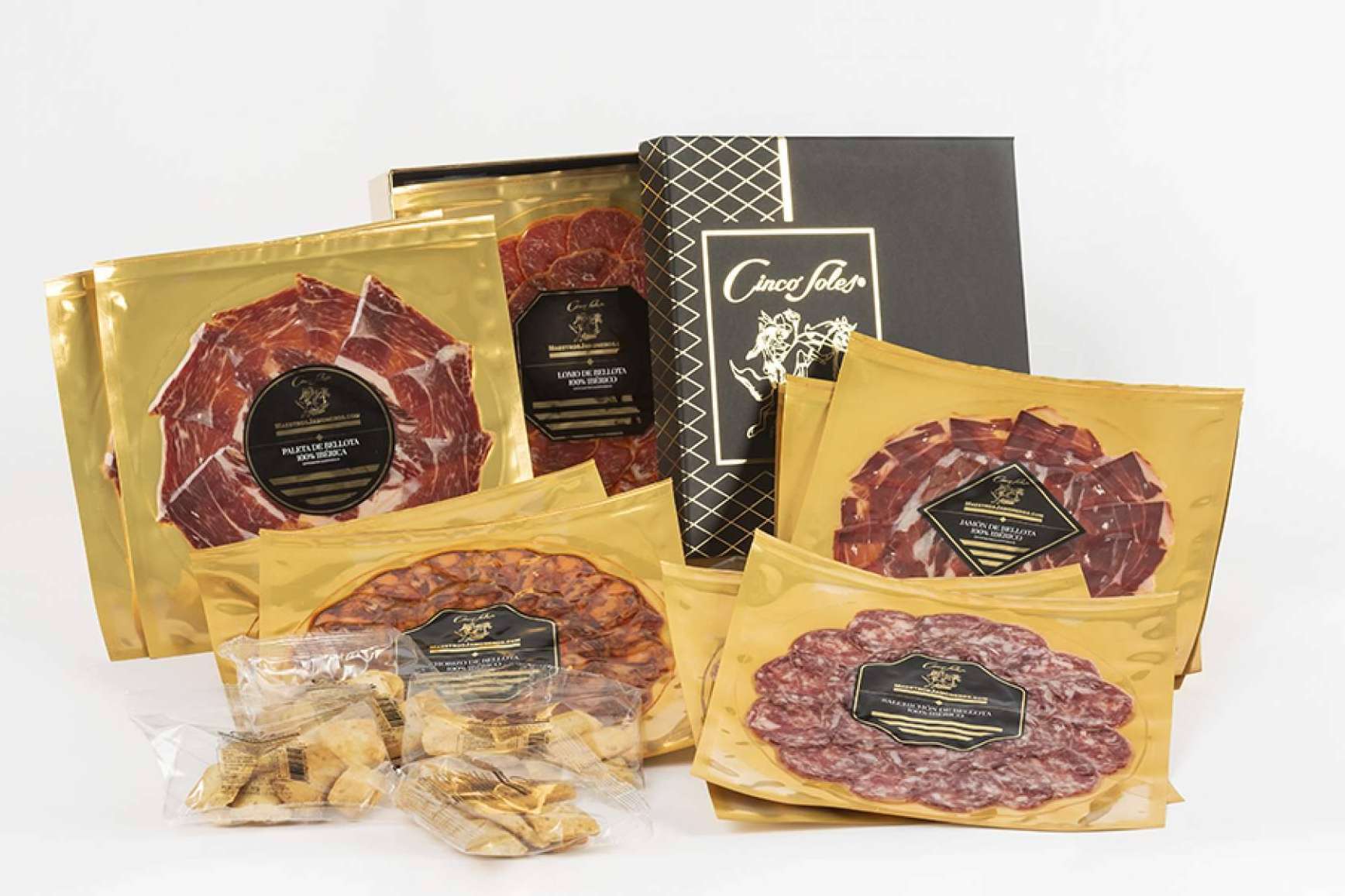 Maestros Jamoneros y sus lotes de Jamón de Bellota ibéricos cortados a cuchillo, uno de los regalos corporativos más buscados para esta Navidad